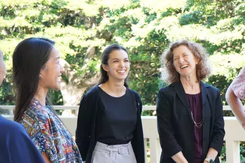 Staff laughing before an event