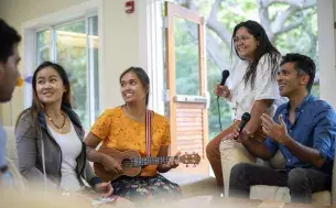 EWC students singing with ukulele