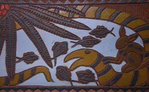 Palauan storyboard "Mengernger me a Katuu" carved by Obak Clarence Kitalong