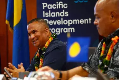 Leaders talk at the 2019 Micronesian Conference of Leaders (MCL). Palauan flags are shown prominently, as is the Pacific Islands Development Program logo.