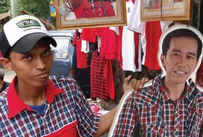 Man with Jokowi cardboard stand-up