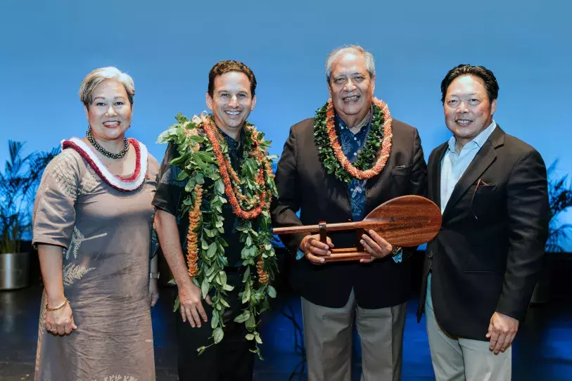 Sen. Brian Schatz receiving the EWC Asia Pacific Community Building Award at the 2023 Gala