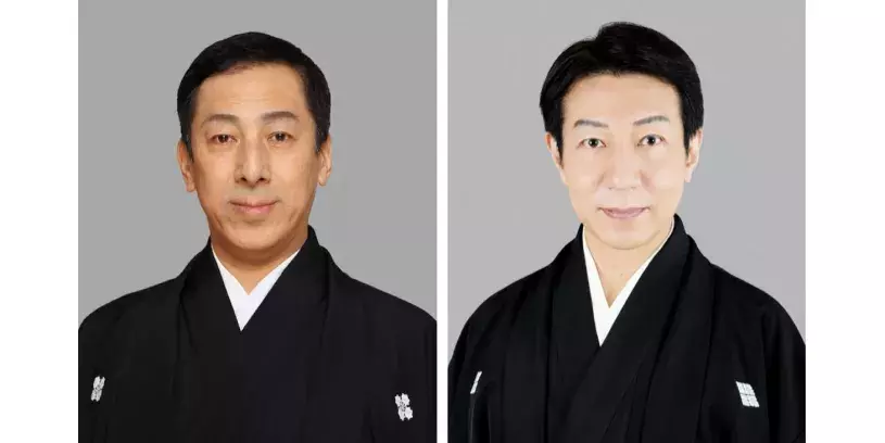 Two Japanese men with short black hair and light skin, wearing black kimono robes