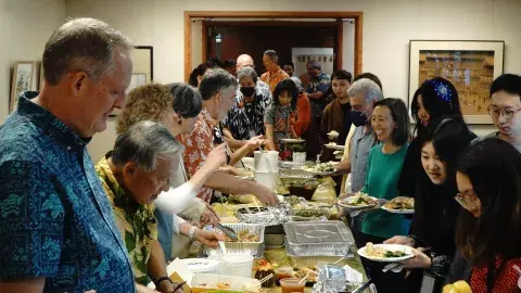 EWC staff sharing food at the 2023 Fall Paʻina