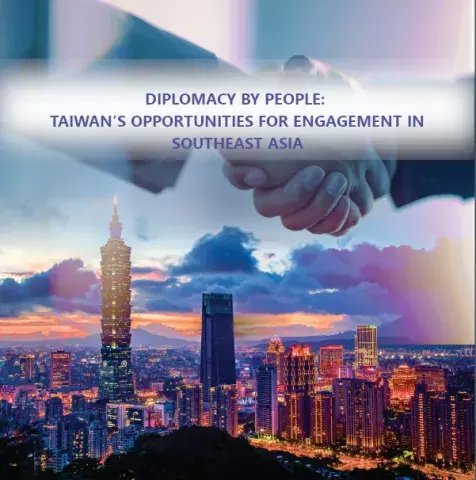 Shaking hands overlay a cityscape of Taiwan