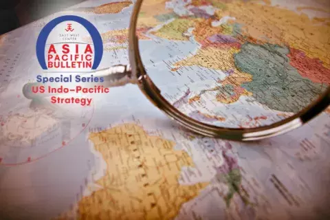 APB Arch indo-pacific special series logo overlaying picture of a magnifying glass strategically focused on the Asia portion of a map