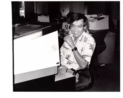 Melvin Goo at the desk at The Honolulu Advertiser.