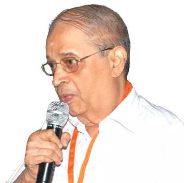 Man named Mr. Panchapakesan “Mani” Subramaniyam speaking into microphone.