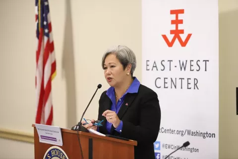 East-West Center President Suzanne Puanani Vares-Lum speaks from a podium on Capitol Hill.